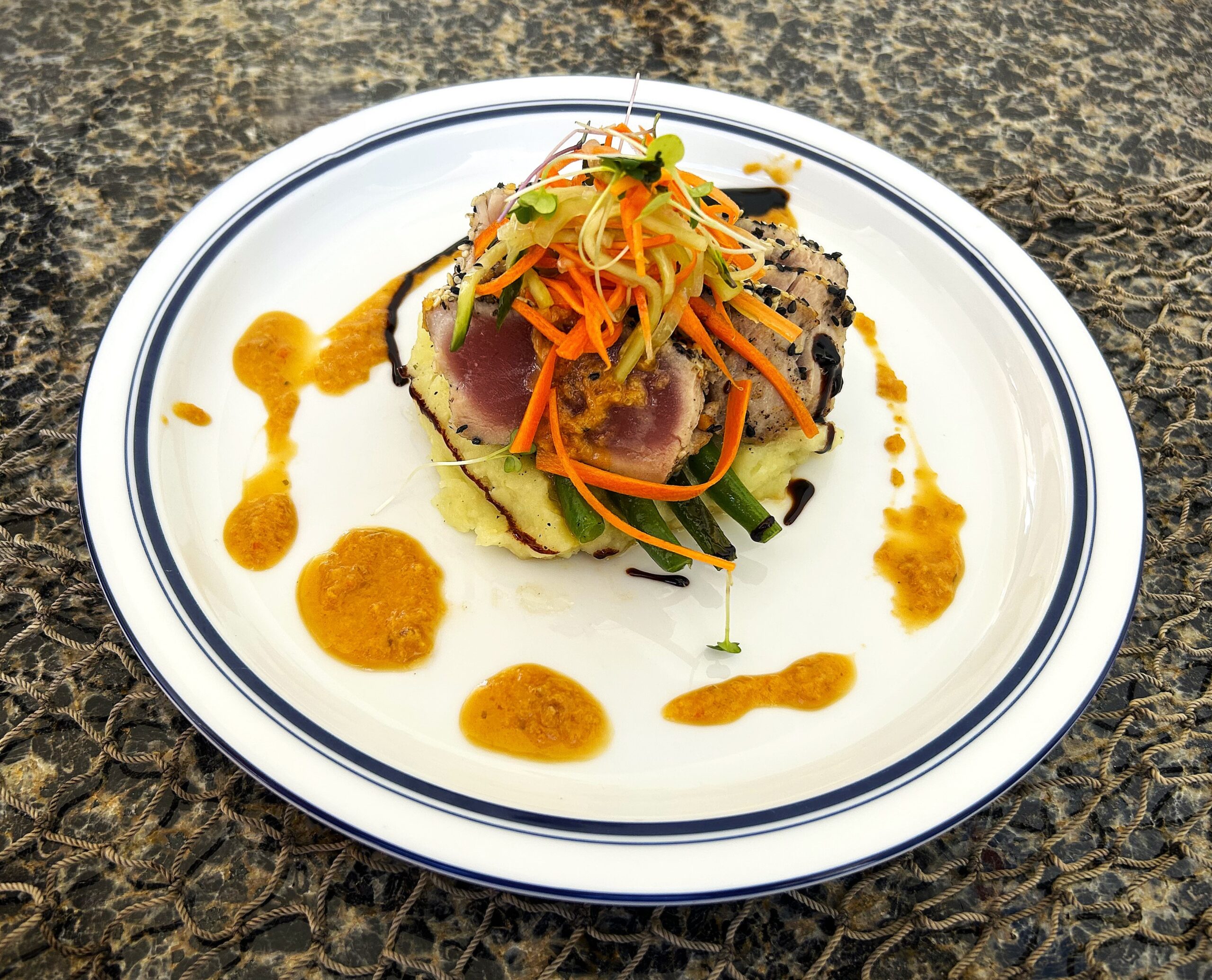 Seared ahi entrée prepared aboard Shangri-La